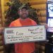person holding large check