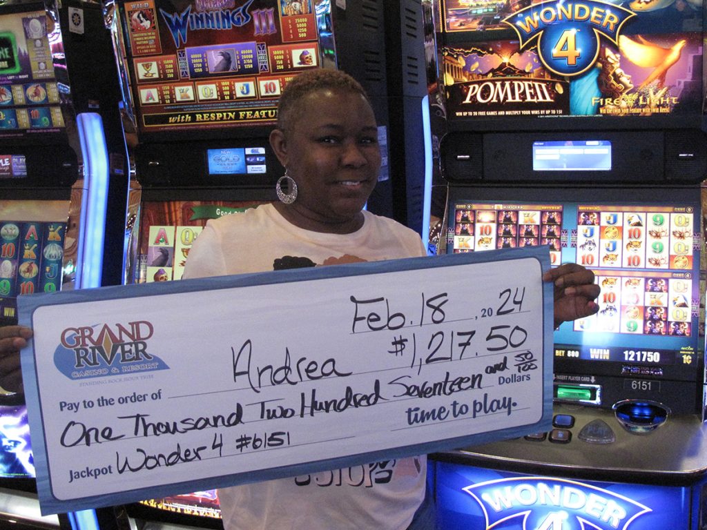 Woman holding large winning check